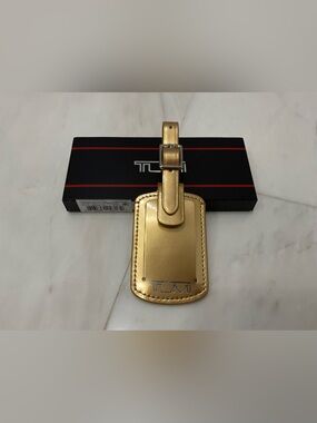 NEW Tumi 3.625” x 2.25” Leather Luggage Name Tag w/ Buckle - METALLIC GOLD